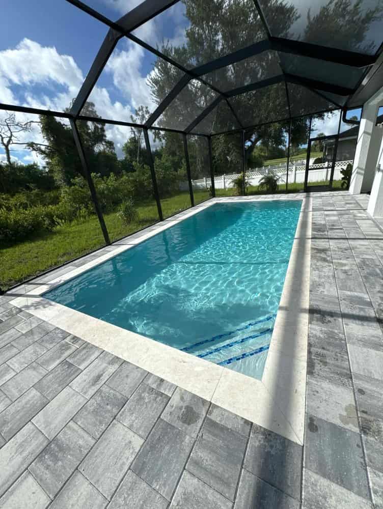 Bright blue gunite pool reflecting sunlight