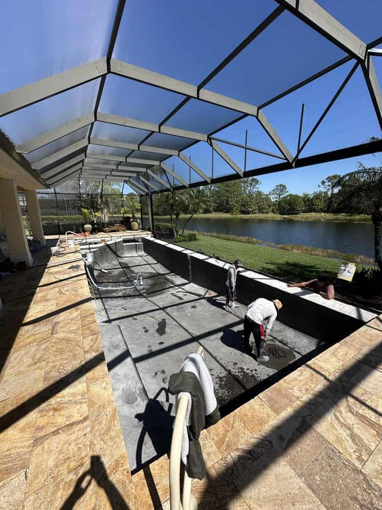 Pool renovation crew resurfacing a pool in Venice, FL